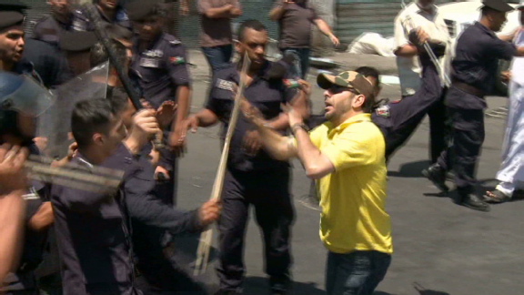 Jordan police use batons on marchers | BahVideo.com