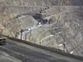 NTSC Large dump truck hauling iron ore in a mine | BahVideo.com