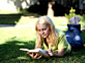 Young woman reading a book | BahVideo.com